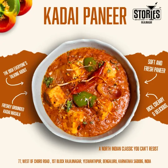 Bowl of kadai paneer with green capsicum and red chilli on a cream and rust background – food poster for Stories Bar & Kitchen, Rajajinagar