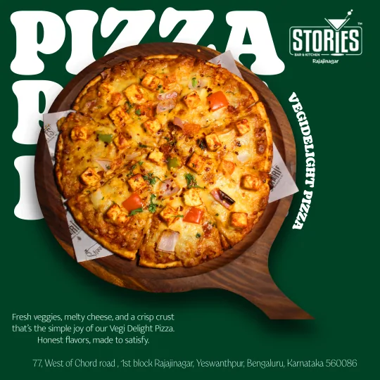 Vegi Delight pizza with paneer and peppers on a wooden board against a green background – food poster for Stories Bar & Kitchen, Rajajinagar
